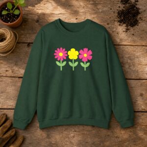 Wildflowers Embroidered Sweatshirt in Forest Green, an embroidered crewneck sweatshirt on a potting bench