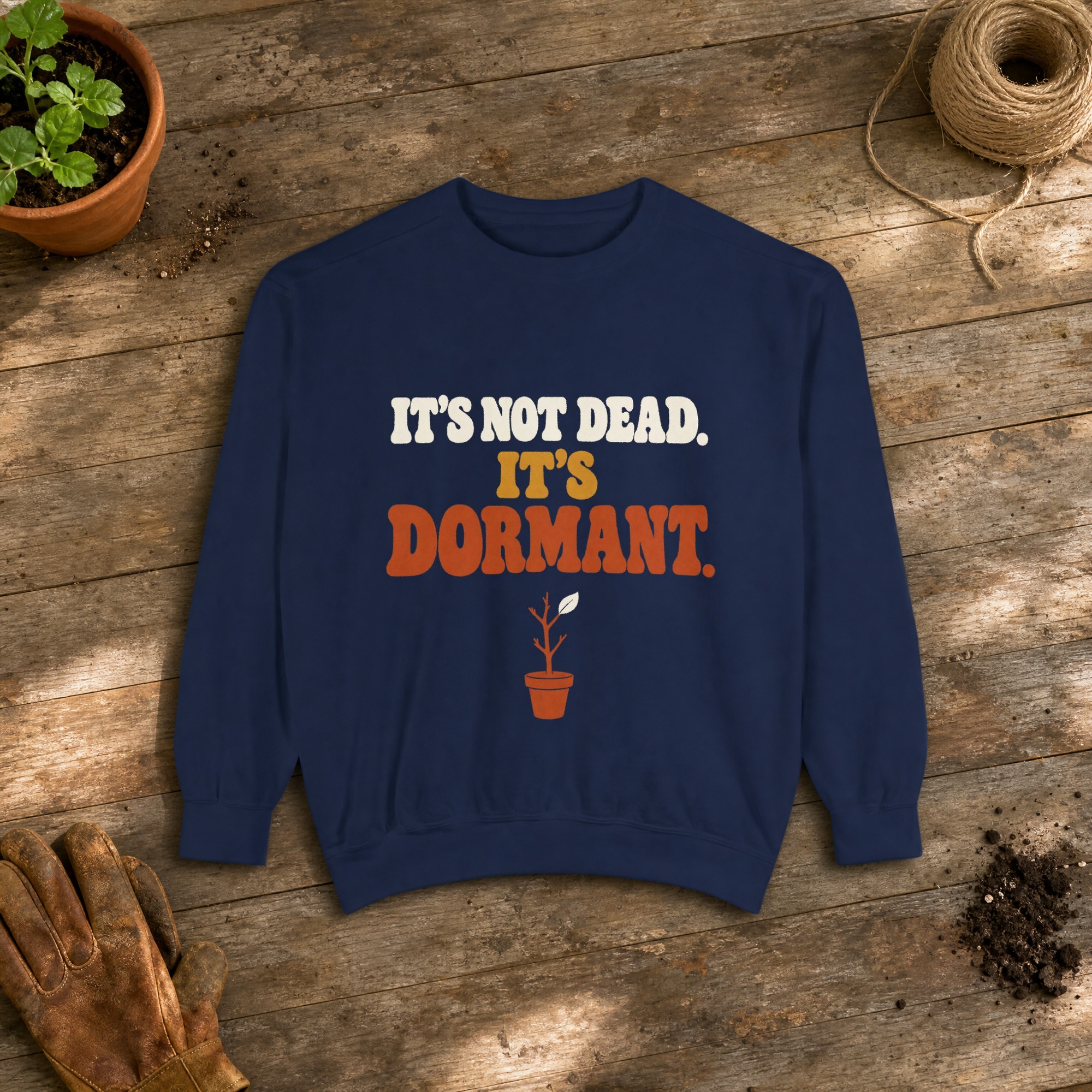 It's Not Dead. It's Dormant. Sweatshirt in True Navy, a crewneck sweatshirt on a potting bench