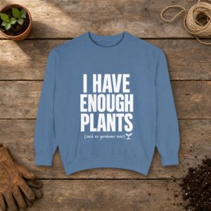 I Have Enough Plants Sweatshirt in Blue Jean, a crewneck sweatshirt on a potting bench